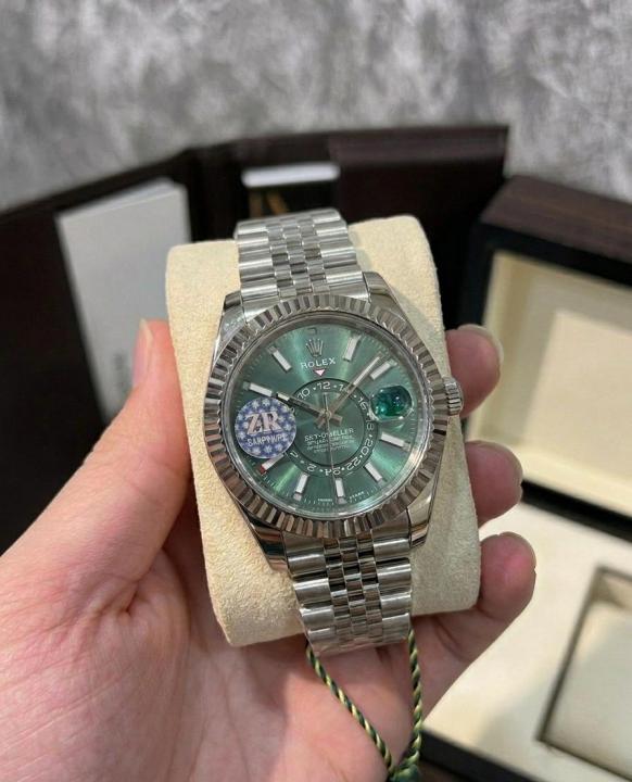 This Rolex Sky-Dweller features a distinctive mint green dial watch